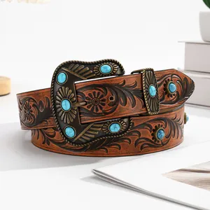 Vintage western cowboy belt with floral embossing and blue turquoise buckle