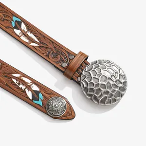 Vintage ethnic brown leather belt with floral embossing and round metal buckle