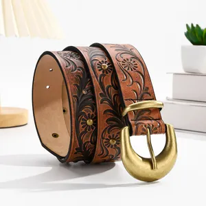 Vintage dark brown embossed leather belt with a large matte gold crescent buckle for women