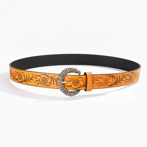 Detailed view of Y2K retro belt with orange leather embossed floral patterns and silver buckle