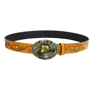 Retro Western cowboy leather belt with floral embossing and turquoise buckle on white background