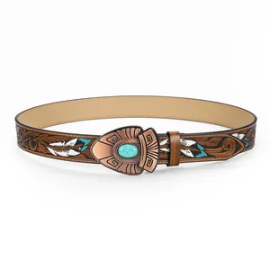 Détail d'une ceinture western vintage en cuir gaufré avec boucle en métal turquoise