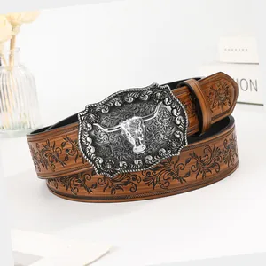 Vintage western cowboy belt in brown leather with floral embossing and buffalo skull buckle