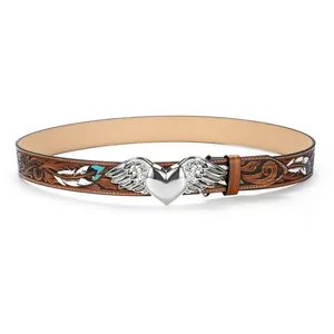 Detail of floral embossed brown leather belt with winged heart buckle and feathers