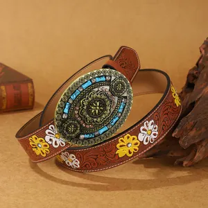 Vintage western PU leather belt with embossed floral patterns and turquoise metal buckle