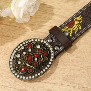 Detail of vintage belt buckle with butterfly pattern and red crystal rhinestones