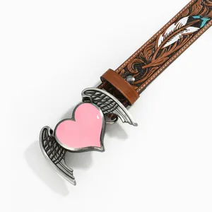 Detail of western style belt with pink heart buckle and floral embossed leather