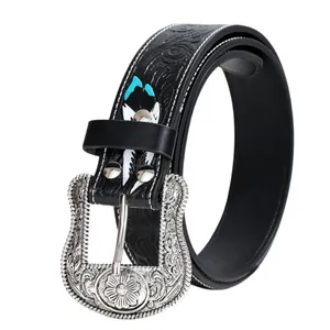 Ceinture femme style western avec motifs floraux gravés et détails en turquoise