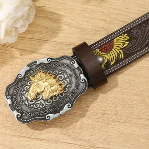 Close-up of vintage leather belt buckle with silver scrollwork and golden horse head emboss