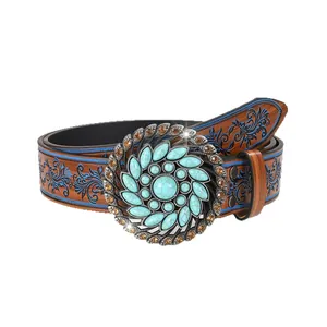 Vintage western style belt with large turquoise buckle and blue embossed floral patterns