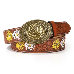 Vintage brown PU leather belt featuring daisy floral embossing and a gold rose buckle