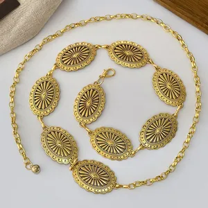 Vintage western style embossed metal chain belt with antique gold sunburst patterns