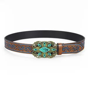 Detail of bohemian leather belt with blue floral embossing and turquoise metal buckle