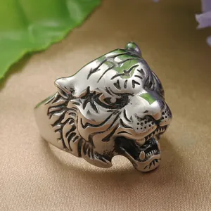Macro shot of silver tiger head ring showing intricate punk details and vintage finish