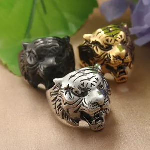 Punk style tiger head rings in antique silver, gold, and gunmetal finishes for men