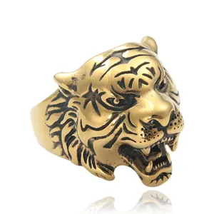 Macro detail of golden stainless steel tiger ring with textured black enamel stripes