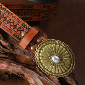 Detailed macro view of western cowboy leather belt with embossed texture and pearl buckle