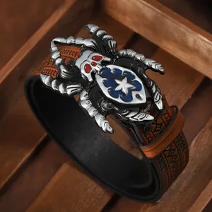 Macro detail of 3D spider buckle with star shield emblem on vintage embossed leather belt