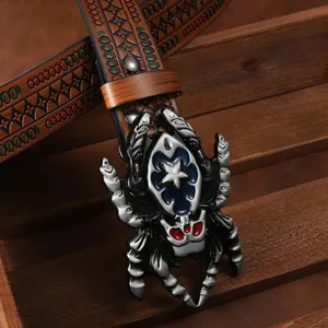 Detail of western cowboy belt featuring a large metallic spider buckle with star accents