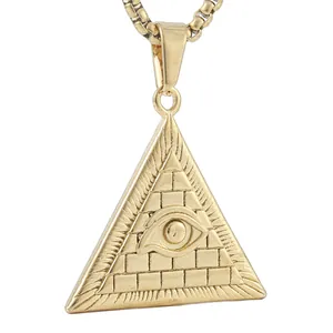 Macro detail of gold stainless steel triangle pendant with Eye of Providence engraving