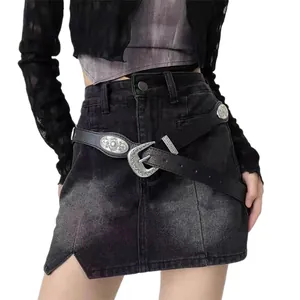 Vintage western black leather belt with silver floral buckle on denim skirt accessory