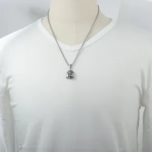 Vintage stainless steel Buddha head pendant necklace with oxidized finish on male model