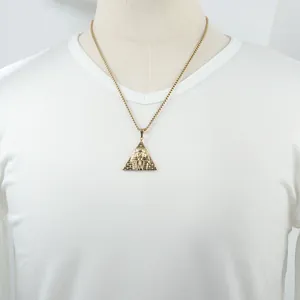 Gold-plated pyramid necklace with Pharaoh pendant in punk style on a white t-shirt