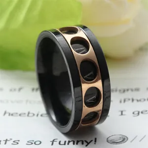 Black and rose gold titanium ring with rotatable Roman numerals in industrial design