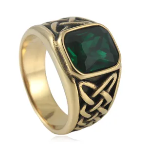 Vintage gold-plated stainless steel ring with green stone and Celtic knot textures