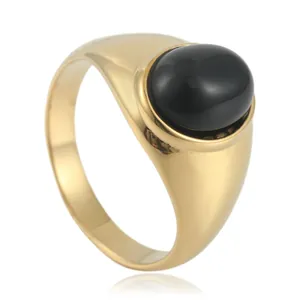Vintage gold-plated stainless steel signet ring featuring a large oval black onyx stone