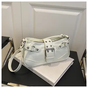 Detail of off-white Y2K crescent bag featuring silver punk rivets and metal buckles