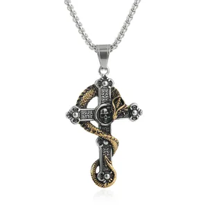 Detail of gothic stainless steel cross pendant with golden snake and skull motif