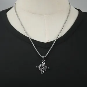 Silver stainless steel Celtic witch knot pendant necklace on a black t-shirt background