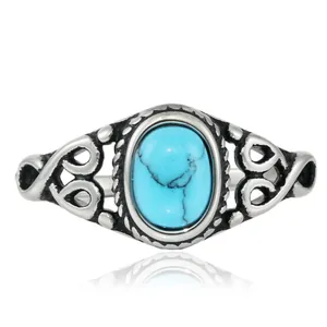Vintage-Ring aus Titanstahl mit ovalem Türkis-Stein und hohl ausgearbeitetem Retro-Muster
