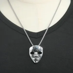 Retro punk style stainless steel mask pendant necklace with silver chain on model