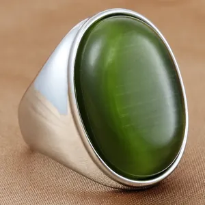 Bague vintage en acier inoxydable avec pierre oeil-de-chat ovale verte et finition argent