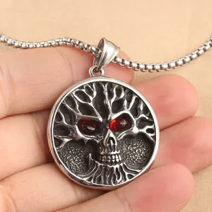 Gothic tree of life skull pendant with red gemstone eyes on a stainless steel chain