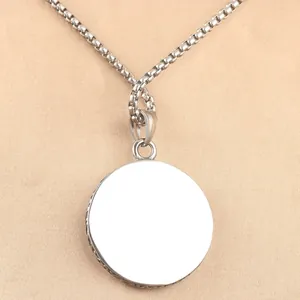 Retro stainless steel sun medallion pendant with vintage engraved edges on box chain
