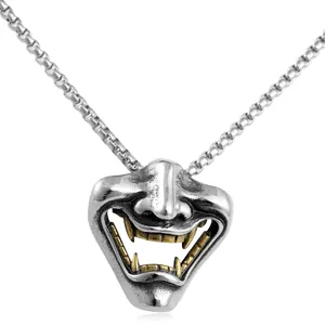 Punk style titanium steel fang mask pendant with silver finish and gold-toned teeth detail
