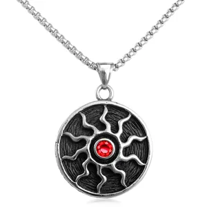 Vintage sun pendant necklace in stainless steel with a bright red crystal centerpiece