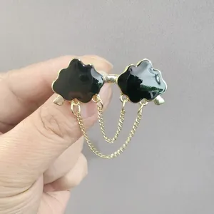 Cloud-shaped sunglasses brooch with gold chain tassels and minimalist metallic finish