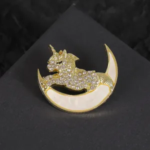 Exquisite gold unicorn and moon brooch with sparkling rhinestones for elegant sweaters