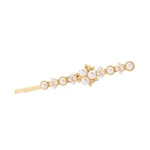 Elegant gold alloy hair clip with white pearl floral clusters on a clean white background