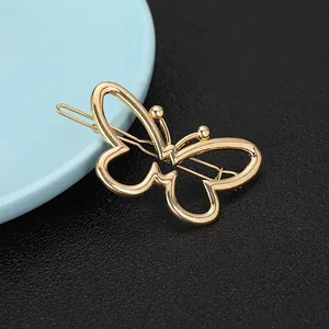 Minimalist hollow butterfly metal hair clip in gold finish with polished geometric lines