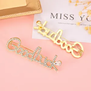 Golden Goodluck letter brooch with sparkling rhinestones and crystal drop for women
