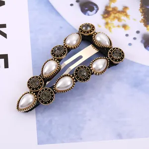 Retro geometric BB hair clip with white pearls and grey rhinestones on bronze base