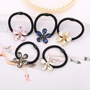 Set de 5 gomas para el pelo con flores de cristal en rosa, azul, gris y dorado