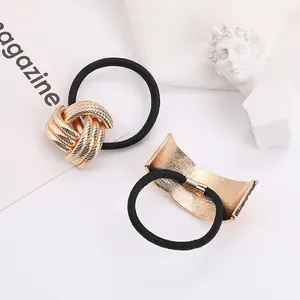 Elegant black hair ties with golden metal ornaments and shell pearl details set of two