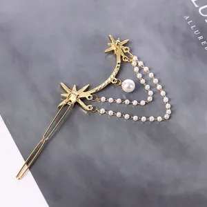 Elegant gold star hair clip with hanging white pearl tassels and vintage star design