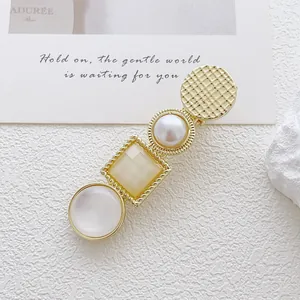 Elegant gold alloy hair clip with cat eye stone, pearls and geometric amber resin stones